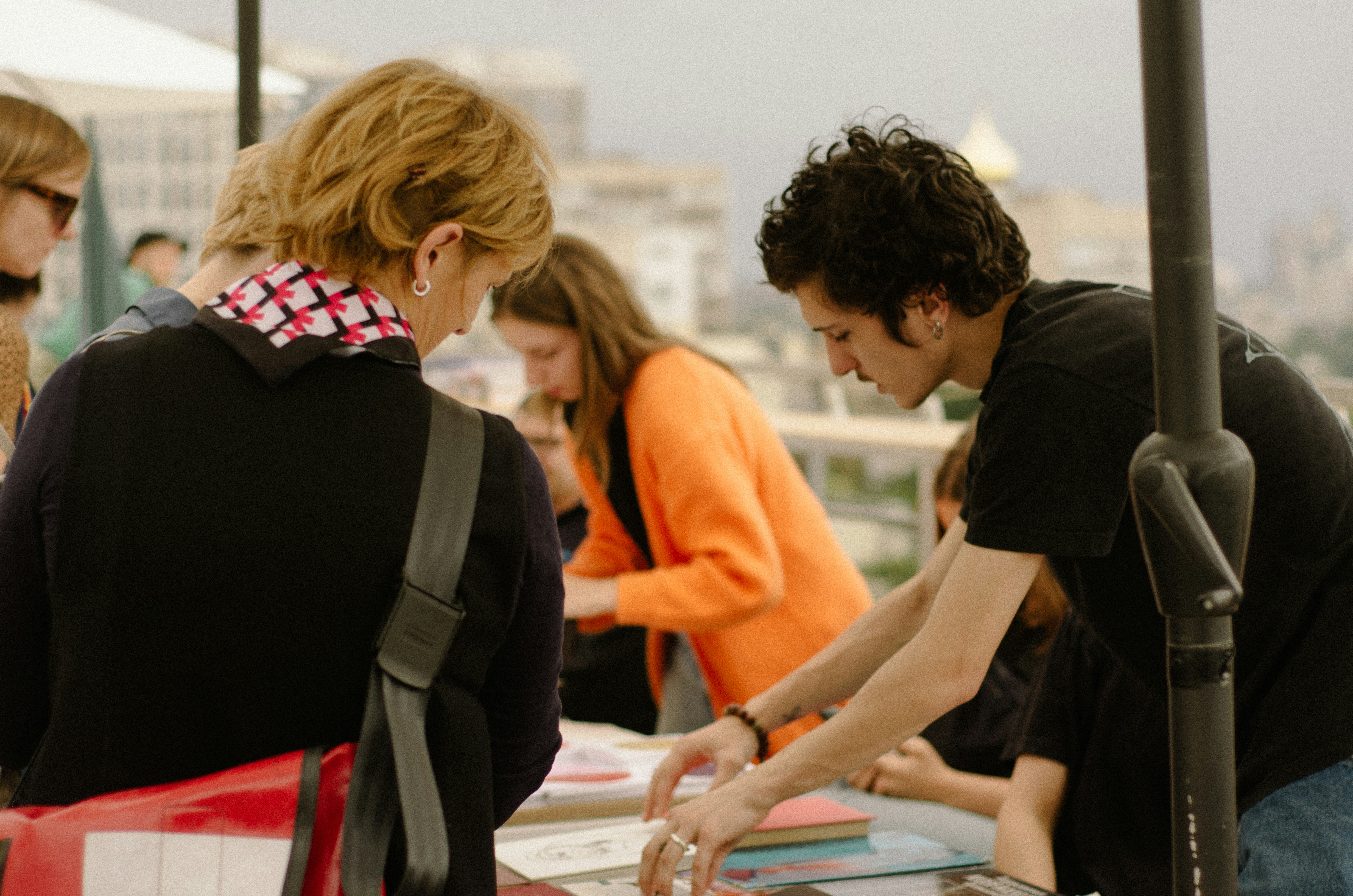 Volunteers preparing materials at a table